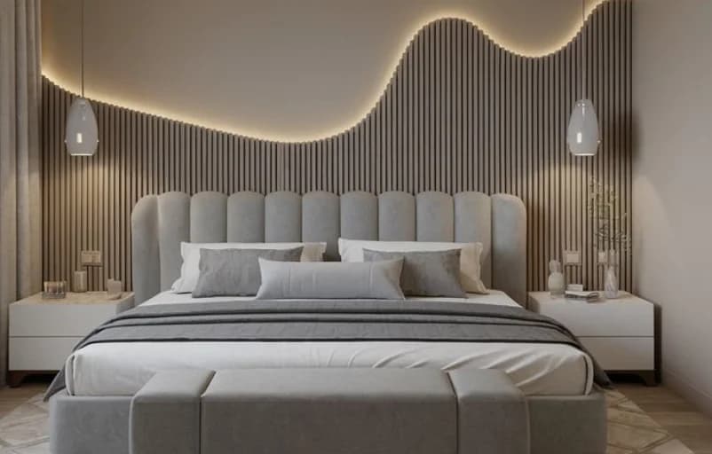 A warmly lit bedroom interior from a Dreamorre residential project